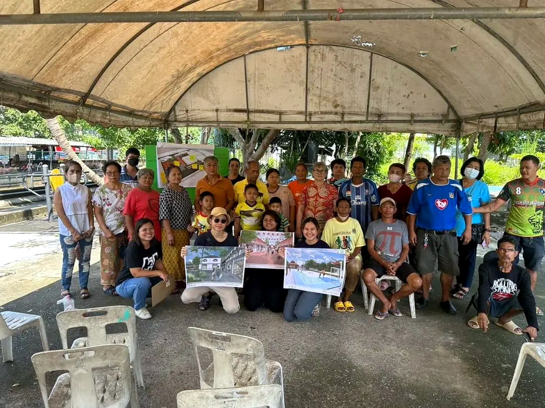 Community participants presenting architectural drawings and design proposals together