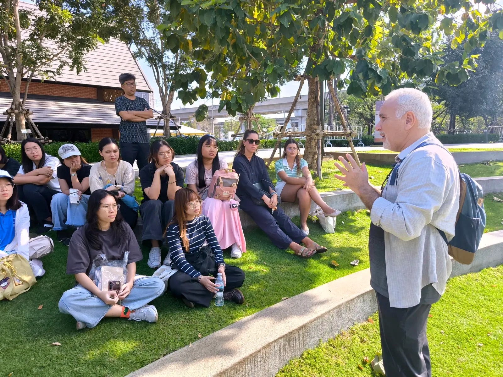 Students gathering with a lecturer during an international outdoor field study